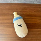 Baby Bottle Treat-Hiding Plush Dog Toy