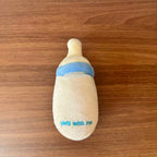Baby Bottle Treat-Hiding Plush Dog Toy