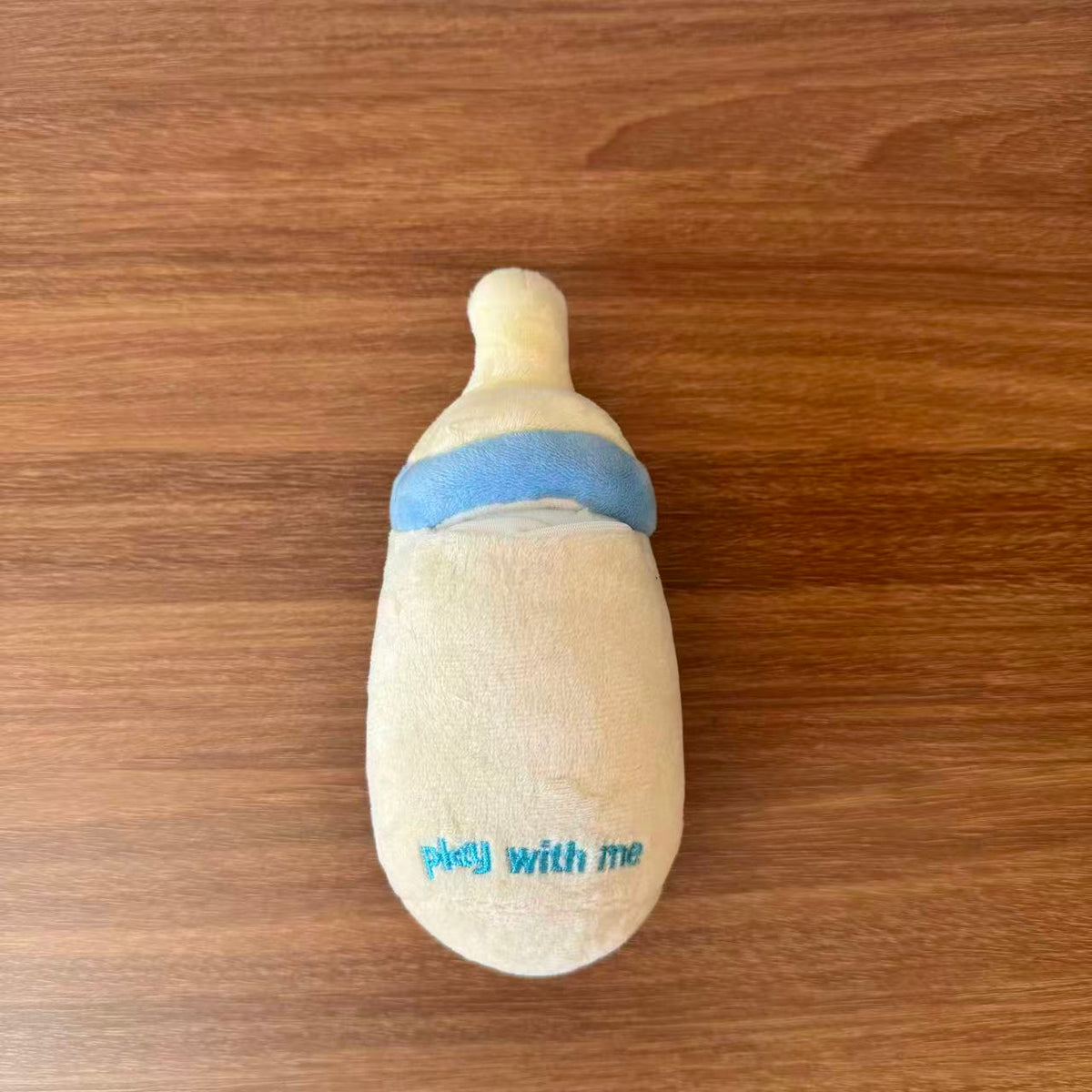 Baby Bottle Treat-Hiding Plush Dog Toy